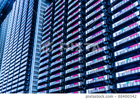 cluster of hard drives inside internet hosting center 88400342