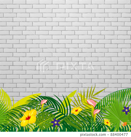 White brick wall background with tropical leaves and flowers 88400477