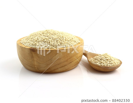 Close up - bowl of white sesame seeds on white background 88402330