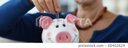 Senior lady save income in container Senior lady save income in container 88402629