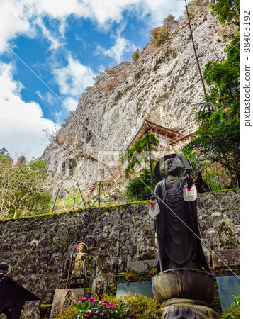 The rocky mountain of Iwayaji Temple that rises behind the statue of Kobo Daishi 88403192