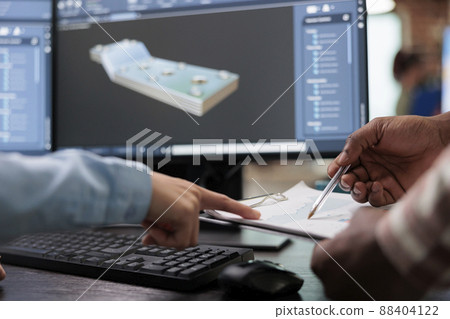 Close up of creative industry employees with clipboard and advanced 3D modeling software open in background. 3D digital artists reviewing sketch scene plan and simulated render times, Close up of creative industry employees with clipboard and advanced 3D modeling software open in background. 3D digital artists reviewing sketch scene plan and simulated render times, 88404122