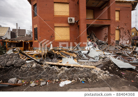 Bila Tserkva, Kyev region Ukraine - 04.03.2022: The consequences of an airstrike, a missile attack on residential buildings in Bila Tserkva. Russian troops destroy houses, people in Ukraine. Bila Tserkva, Kyev region Ukraine - 04.03.2022: The consequences of an airstrike, a missile attack on residential buildings in Bila Tserkva. Russian troops destroy houses, people in Ukraine. 88404308