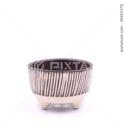 Handmade brown flower ceramic pot on white background Handmade brown flower ceramic pot on white background 88405378