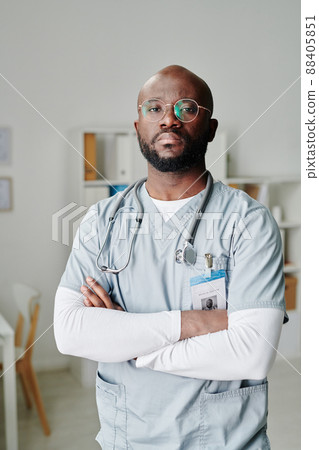 Serious young African American male clinician with phonendoscope on his neck Serious young African American male clinician with phonendoscope on his neck 88405851