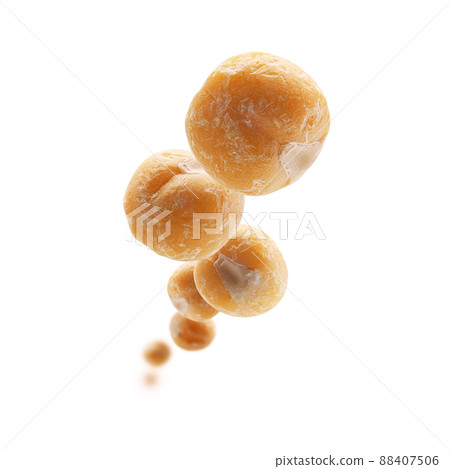 Dry yellow peas levitate on a white background 88407506