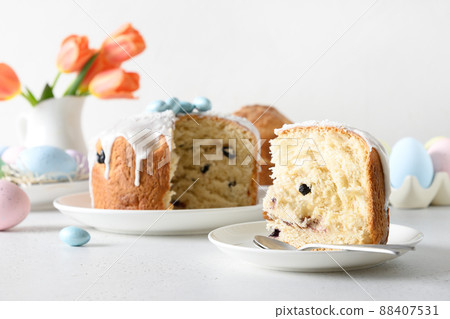 Cutted Easter cake decorated eggs. Christian custom. Cutted Easter cake decorated eggs. Christian custom. 88407531