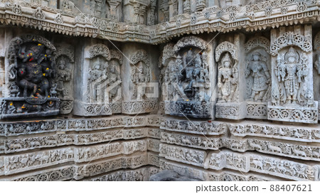 Sculptures of Lord Ganesha, Lord Shiva and Lord Vishnu with war Sculptures on the wall of javagal Temple, Hassan, Karnataka. 88407621
