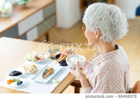 Senior woman eating Senior woman eating 88408078