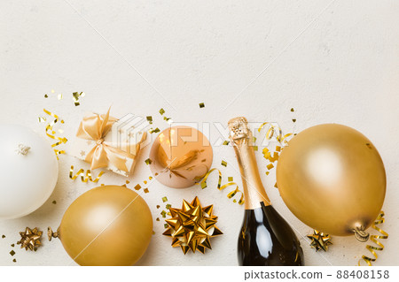 Holiday background with colorful balloon, gift and confetti. Flat lay style. Birthday or party greeting card with copy space Holiday background with colorful balloon, gift and confetti. Flat lay style. Birthday or party greeting card with copy space 88408158