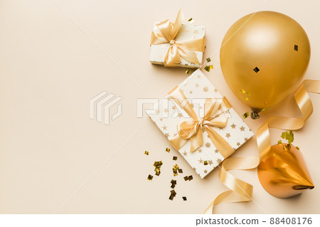Holiday background with colorful balloon, gift and confetti. Flat lay style. Birthday or party greeting card with copy space 88408176
