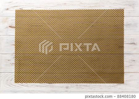 Top view of brown tablecloth for food on wooden background. Empty space for your design 88408180