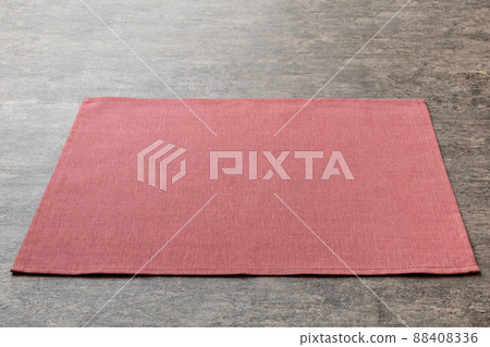 Perspective view of red tablecloth for food on cement background. Empty space for your design 88408336