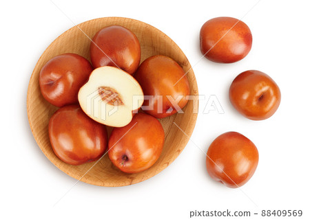jujube or chinese date in wooden bowl isolated on white background with clipping path. Top view. Flat lay jujube or chinese date in wooden bowl isolated on white background with clipping path. Top view. Flat lay 88409569
