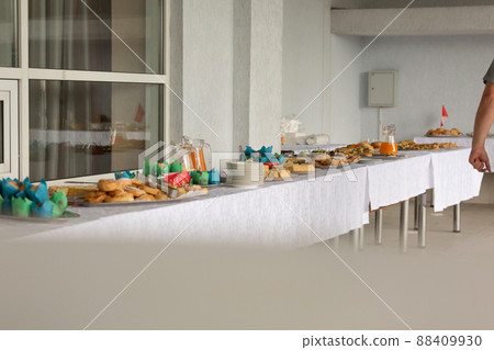 Catering or self-service desk for a conference or business meeting. Snacks and drinks for a light snack in the office. Catering or self-service desk for a conference or business meeting. Snacks and drinks for a light snack in the office. 88409930