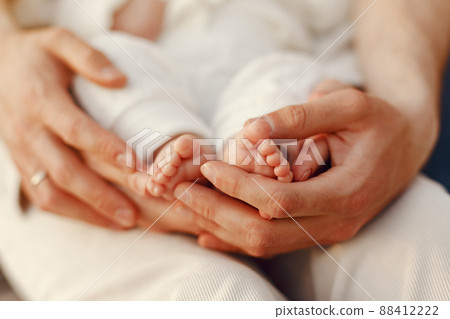 Parents with daughter. Family in a park. Newborn girl. 88412222