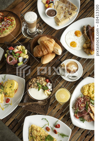 Western big gourmet breakfast selection mixed dishes on restaurant table 88413300