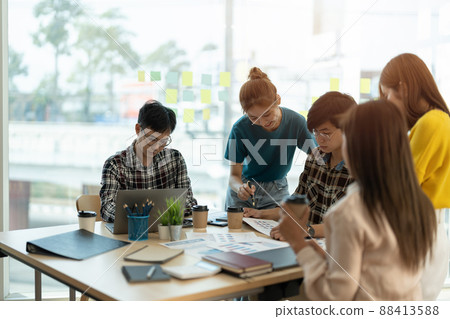 Asian business adviser meeting to analyze and discuss the situation on the financial report in the meeting room.Investment Consultant, Financial advisor and accounting concept Asian business adviser meeting to analyze and discuss the situation on the financial report in the meeting room.Investment Consultant, Financial advisor and accounting concept 88413588