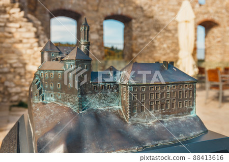 small model of the Rabsztyn Castle with real building in the background, Braille system small model of the Rabsztyn Castle with real building in the background, Braille system 88413616
