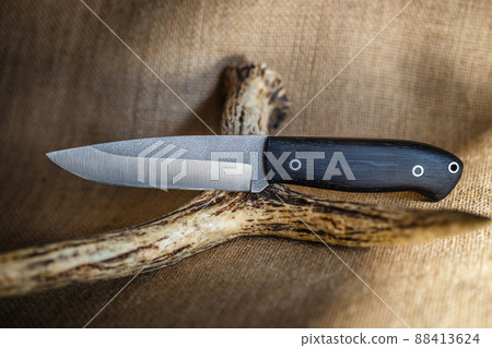 hunting knife handmade on a brown background hunting knife handmade on a brown background 88413624