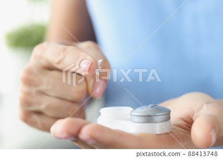 Fingertip contact lenses and storage box closeup Fingertip contact lenses and storage box closeup 88413748