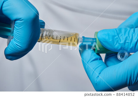 Beautician doctor's hands put test tube with blood in centrifuge container. Rejuvenation plasmolifting procedure. Beautician doctor's hands put test tube with blood in centrifuge container. Rejuvenation plasmolifting procedure. 88414852