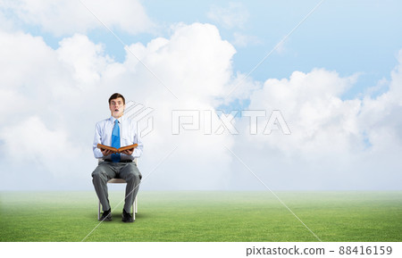 young businessman with book young businessman with book 88416159