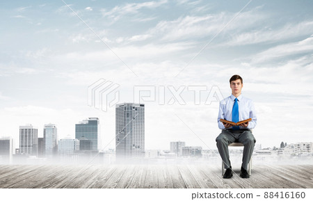 young businessman with book young businessman with book 88416160