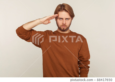 Portrait of emotional bearded man on gray background. 88417650