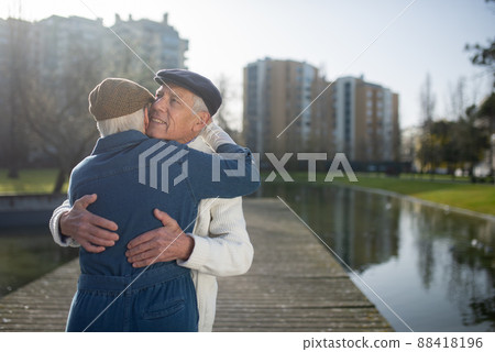 Happy elderly couple dating in spring park 88418196