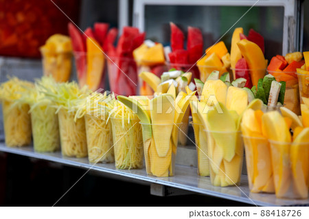 Street sell of mango and other fruits at the beautiful streets of Salento an small town located at the Quindio region in Colombia 88418726