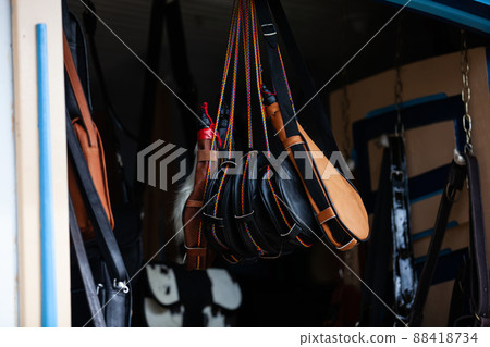 Traditional handcrafted wineskin boots in Salento an small town of the region of Quindio in Colombia 88418734