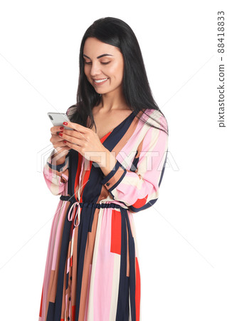 Beautiful young woman with phone on white background 88418833
