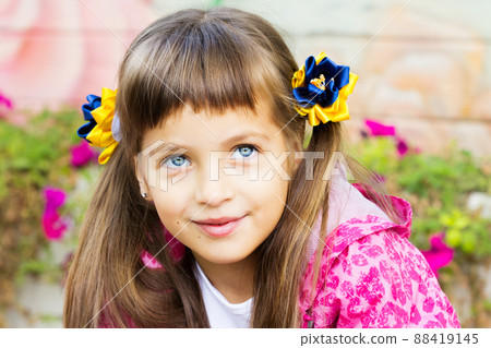 Flag Day of Independence of Ukraine. Stop WAR. Ukrainian girl in an embroidered vyshyvanka shirt with a yellow-blue flag of Ukraine. Symbols of the flag of Ukraine. Freedom. Russia terror. Kyiv. Flag Day of Independence of Ukraine. Stop WAR. Ukrainian girl in an embroidered vyshyvanka shirt with a yellow-blue flag of Ukraine. Symbols of the flag of Ukraine. Freedom. Russia terror. Kyiv. 88419145