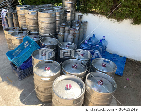 beer kegs. many metal beer keg stand in rows in a warehouse. 88419249