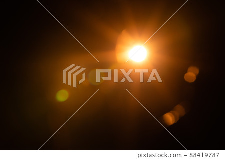 Solar lens flare on black background Solar lens flare on black background 88419787