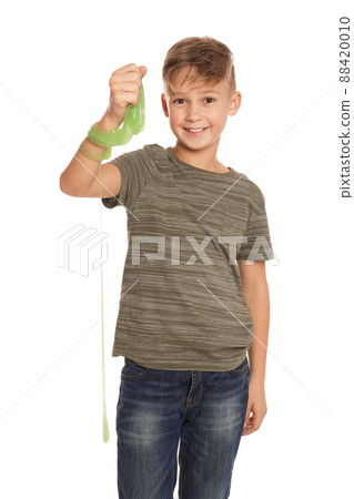 Preteen boy with slime on white background Preteen boy with slime on white background 88420010