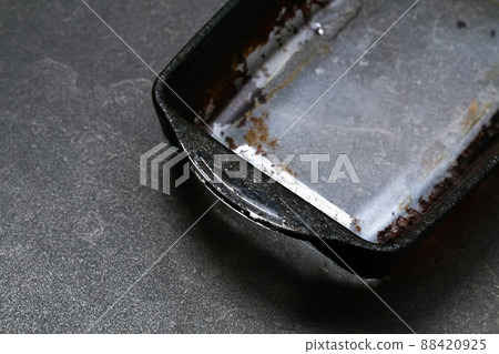 Dirty baking dish with thick layer of carbon Dirty baking dish with thick layer of carbon 88420925