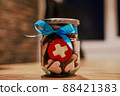 Jar with cookies in form of hearts and swiss flag cookie 88421383