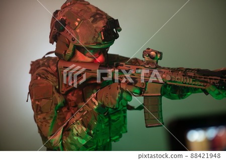 Dedicated man aiming with machinegun 88421948
