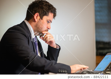 Side view of attentive man working Side view of attentive man working 88422111