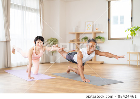 Senior couple doing yoga Senior couple doing yoga 88424461
