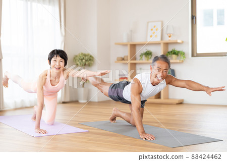 Senior couple doing yoga Senior couple doing yoga 88424462