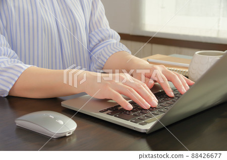 Women handling personal computers 88426677