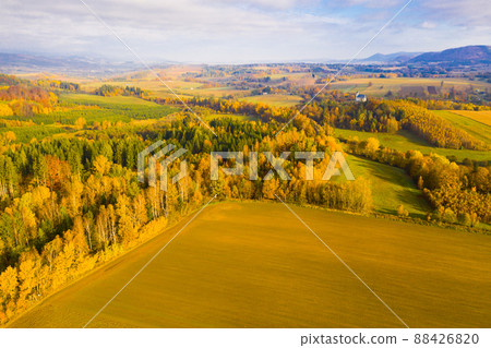 Picturesque autumn view with church on a hill 88426820