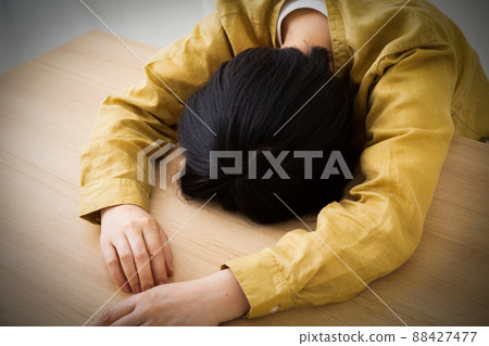 Middle-aged women suffering (fatigue, depression) 88427477