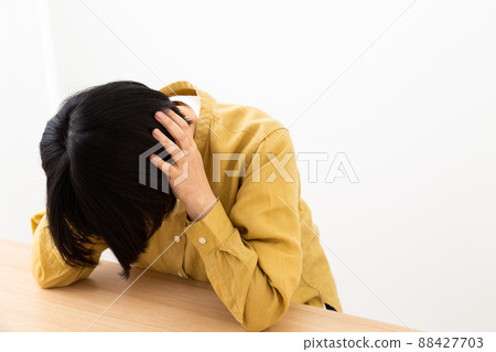 Middle-aged women suffering (deafness, depression) Middle-aged women suffering (deafness, depression) 88427703