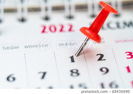 Red push pin on calendar 1th day of the month, mark the Event day with a Pin. Pin on calendar day one, date number 1. First day of the month is marked with a red thumbtack Red push pin on calendar 1th day of the month, mark the Event day with a Pin. Pin on calendar day one, date number 1. First day of the month is marked with a red thumbtack 88430890