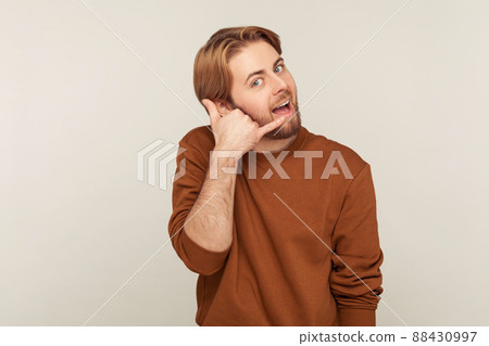 Portrait of emotional bearded man on gray background. 88430997