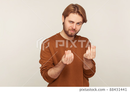 Portrait of emotional bearded man on gray background. 88431441